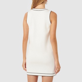 Model wearing Forever New Molly Tipped Mini Dress in white with black contrast tipping, sleeveless design and straight hemline, back view