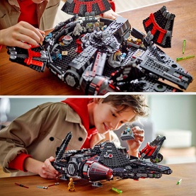 Child building and displaying the Lego Star Wars The Dark Falcon, a large dark-coloured buildable starship with red accents, 1,579 pieces