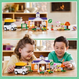 Lego Animal Crossing KK's Concert at the Plaza set with two children playing, featuring town hall, camper van, caf&eacute; stand and minifigures