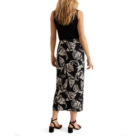 Model wearing Phase Eight Ayana Printed Skirt in black leaf print midi length, styled with black sleeveless top and strappy heels