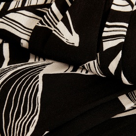 Phase Eight Ayana Printed Skirt in black, close-up of abstract leaf print fabric in black and white viscose blend