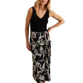 Model wearing Phase Eight Ayana Printed Skirt in black with leaf print midi flared silhouette, styled with a black sleeveless top
