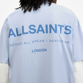 Model wearing All Saints Access Logo Oversized T-Shirt in blue, rear view showing ALLSAINTS Access All Areas London graphic print