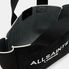 All Saints Izzy Knitted Mini Tote Bag in black, interior view showing grey lining, with jacquard logo and top handles visible