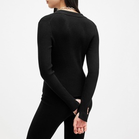Model wearing All Saints Cruz Ribbed Cardigan in black, shown from behind, with ribbed texture, long sleeves and split button cuffs visible