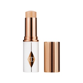 Charlotte Tilbury Hyaluronic Happipeel foundation stick in warm beige with rose gold cap, white barrel, open and closed