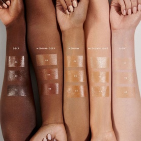 FENTY Hydra Vizor Huez Tinted Moisturizer SPF 30 swatches across five skin tones from Deep to Light on raised forearms