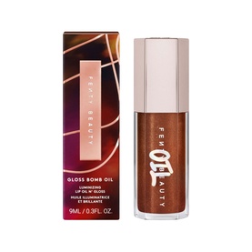 Fenty Gloss Bomb Oil in Coppa Cookie, 9ml, warm bronze lip oil with rose gold cap shown alongside branded box