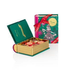 Venchi Mini Book Natale Anna Higgie 118g green gift box with floral festive design, red ribbon, open to reveal assorted chocolates