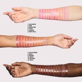 MAC Glow Play Tendertalk Lip Balm shades swatched across three arms in light, medium, and deep skin tones, showing 12 sheer pink and nude shades