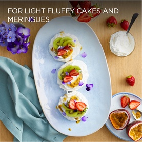 Kenwood Quickmix Go Hand Mixer lifestyle shot showing light fluffy meringues topped with cream, kiwi