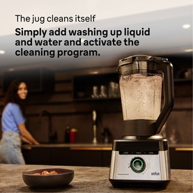 Braun Powerblend 7 black blender on kitchen counter, self-cleaning feature highlighted, with woman in background