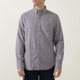 Model wearing Gant Checked Light Twill Regular Shirt in red and navy check, with button-down collar and chest pocket