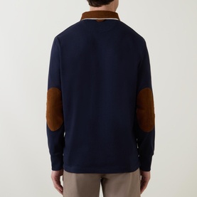 Model wearing Gant Corduroy Collared Rugby Shirt in navy, rear view showing tan corduroy elbow patches and collar, ribbed cuffs