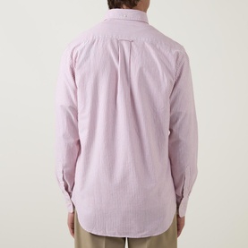 Model wearing Gant Shield Striped Casual Shirt in pink stripe, rear view showing curved hemline and back pleat detail