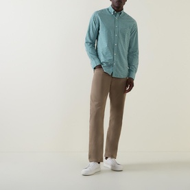 Model wearing Gant Gingham Single-Cuff Casual Shirt in green with button-down collar, styled with beige chinos and white trainers