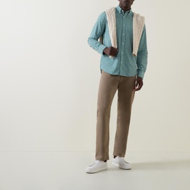 Model wearing Gant Gingham Single-Cuff Casual Shirt in green with button-down collar, styled with beige trousers and white trainers