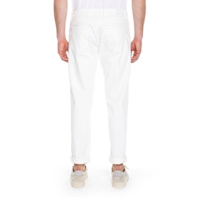 Model wearing Eleventy Mid-Rise Straight Leg Jeans in white, rear view showing back pockets and logo patch, styled with grey trainers