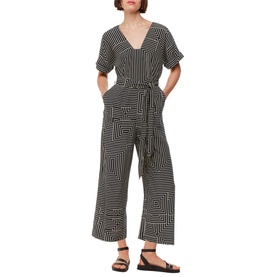 Model wearing Whistles Printed Jumpsuit in multi angled stripe print, V-neck, short sleeves, self-tie belt, wide-leg crop, with black strappy sandals