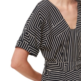 Model wearing Whistles Printed Jumpsuit in black and white angled stripe print, close-up of V-neckline and short sleeves