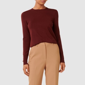 Model wearing Forever New Katie Split-Cuff Sweater in burgundy, long sleeves with button-detail cuffs, crew neck, styled with camel trousers