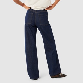 Model wearing Forever New Sky High-Rise Straight Leg Jeans in dark blue wash, straight-leg silhouette, contrast stitching