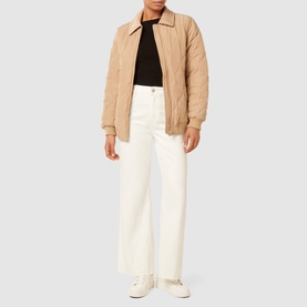 Model wearing Forever New Jacinta Quilted Jacket in brown with classic collar and front zip, styled with white wide-leg jeans and black top