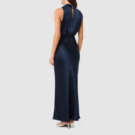 Model wearing Forever New Sienna Satin Flared Dress in blue, showing back keyhole button detail, high neck, and floor-length satin skirt