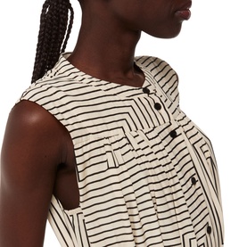 Model wearing Whistles Ilana Striped Shirt Dress in cream, sleeveless with button placket and angled black stripe design, close-up detail view