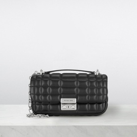 MMK Tribecca Quilted Small Crossbody Bag in black leather with silver-tone hardware, chain strap, and all-over quilted finish
