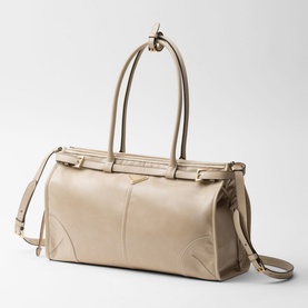 Prada Accessories Bonnie Large Leather Handbag in cream with gold-tone hardware, buckle strap detailing