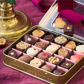 Cartwright & Butler Merry Christmas Belgian Chocolates Selection in gold tin, featuring 25 assorted milk, dark and white chocolates