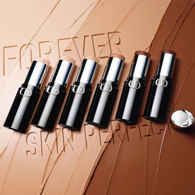 Dior Forever Skin Perfect Foundation Stick range of six shades displayed upright against swatched foundation tones