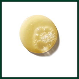 AVEDA Invati Ultra Advanced Exfoliating Shampoo Rich, pale yellow gel texture shown as a domed disc with bubble details