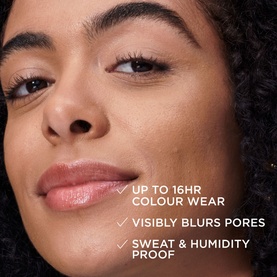 Model wearing IT COSMETICS Your Skin But Better CC+ Natural Matte SPF 40 in Fair Warm, with on-skin claims including 16HR wear and pore-blurring