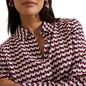 Model wearing Phase Eight Gina Printed Shirt in multi, featuring purple geometric print, classic collar