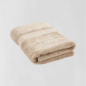 Sheridan Luxury Egyptian Towel in Natural, folded, showing soft looped texture and tonal border stripe, 100% Egyptian cotton