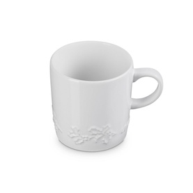Le Creuset Stoneware Holly Mug 350ml in white with embossed seasonal holly motif detail around the base