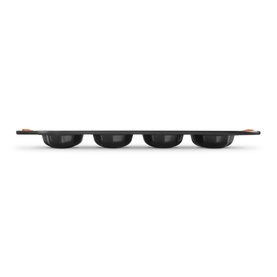 Le Creuset 12-Cup Non-Stick Bakeware Star Tray 40cm in black, carbon steel with silicone coating, side profile view showing cup depth