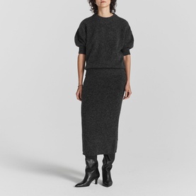 Model wearing Twist & Tango Remi Knit Sweater in grey with short puff sleeves, styled with matching knit midi skirt and black boots
