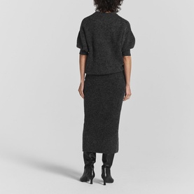 Model wearing Twist & Tango Remi Knit Sweater in grey with short puff sleeves, styled with a matching knit midi skirt and black knee-high boots
