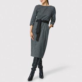 Model wearing Helen McAlinden Caroline Belted Pencil Dress in grey herringbone with black belt, styled with black knee-high boots