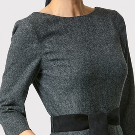 Model wearing Helen McAlinden Caroline Belted Pencil Dress in grey, showing bateau neckline, three-quarter sleeves and black self-tie belt detail