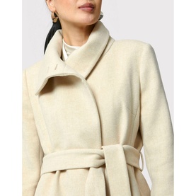Model wearing Helen McAlinden Hazel Wrap Coat in cream, showing wide lapels, wrap front and self-fabric belt. Styled with layered necklaces