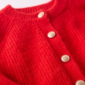 Mint Velvet Military Rib Knit Cardigan in red, close-up showing ribbed knit texture and gold military button fastening detail