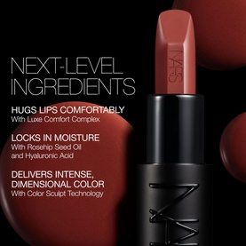 NARS Explicit Lipstick in Incendiary, a warm terracotta bullet, shown upright alongside key ingredient claims including Hyaluronic Acid and Rosehip