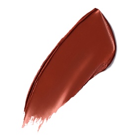 Nars Explicit Lipstick Refill swatch in a warm terracotta-red shade with a satin finish