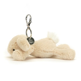 Jellycat Smudge Rabbit Bag Charm 13cm in cream, lying pose with fluffy white tail and silver lobster clasp clip