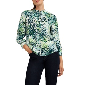 Model wearing Hobbs Beatrix Floral Blouse in white with green floral print, band collar, half button placket, and three-quarter sleeves