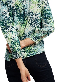 Model wearing Hobbs Beatrix Floral Blouse in white, green floral print, band collar, half button placket, three-quarter sleeves
